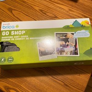 NWT. Munchkin Go shop shopping cart cover.